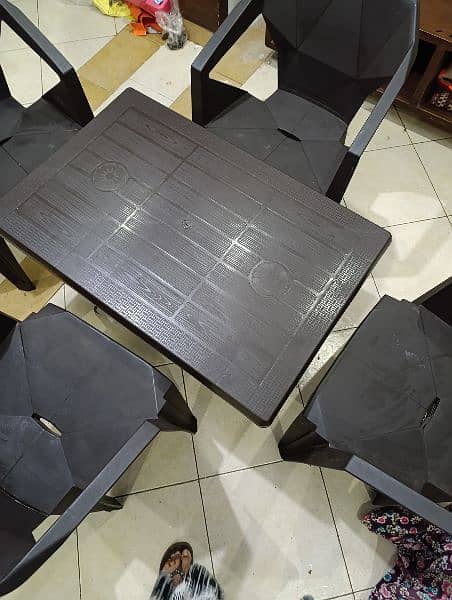 Brown Plastic Table with 4 Chairs 2