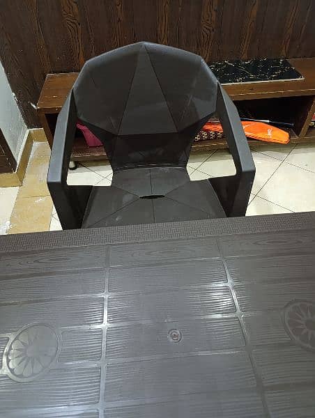 Brown Plastic Table with 4 Chairs 3