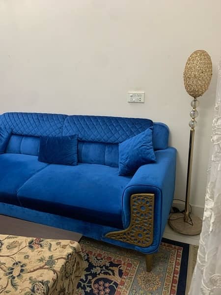 7 seater sofa, wooden Table, lamp, glass vase For sale. 10/10 condition 1