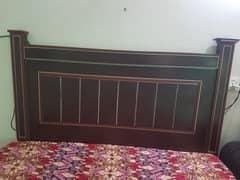 A good quality solid wooden + plaai double bed without mattress