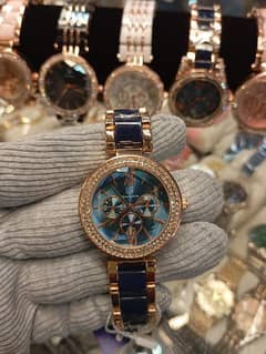 Women Rounded Diamonds Dial Wrist Watch