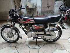 new Honda 125 with lamination and seat cover 0