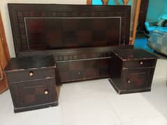 slightly used wooden bed with side tables 0