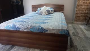 Double bed with mattress and bookcase