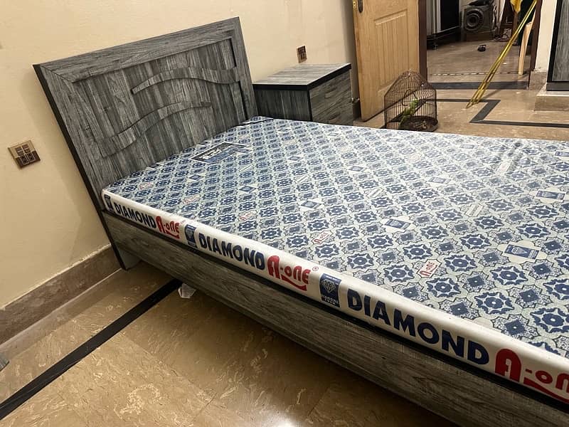 single bed with foam and one side table 2