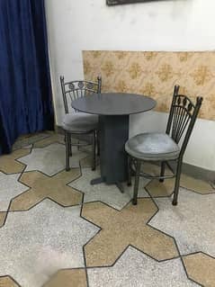 2 chairs with table