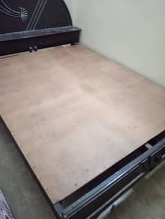 A 6 years used wooden double bed