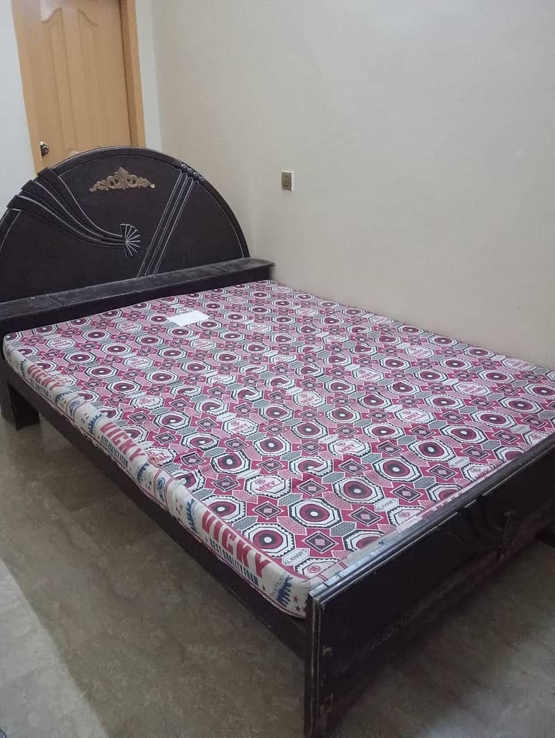 A 6 years used wooden double bed 3