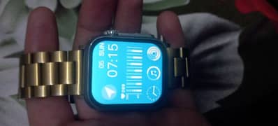 digital watch with golden chain strap