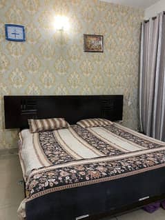 King size dark brown wooden bed only (polished)