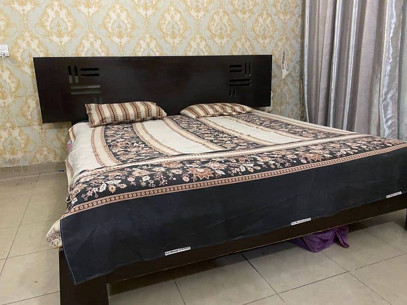 King size dark brown wooden bed only (polished) 1