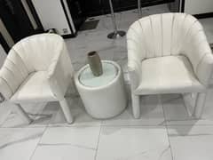 white leather chairs with table