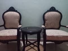 bedroom chairs and a table 0