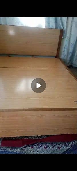 A bed, A trauli of 3 drawers and an iron stand 3