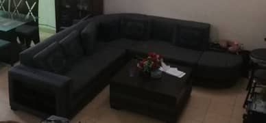 L shaped sofa with center table