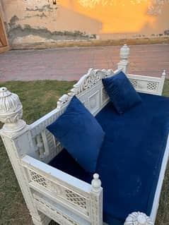 white sofa with blue velvet sofa seat with cushions