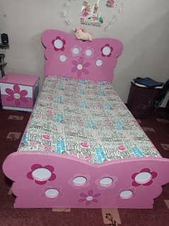 single bed with side table and mattress