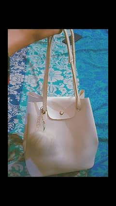 white bag from Turky with great quality and a white furry keychain