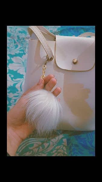 white bag from Turky with great quality and a white furry keychain 1