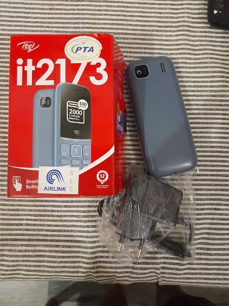 itel 2173 in new condition with box and original charger 2