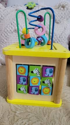 wooden activity cube with abacus