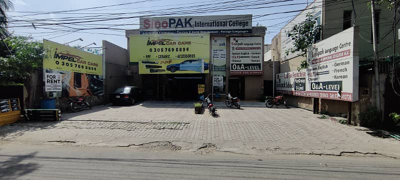 1 kanal building with parking on main faisal town road 16