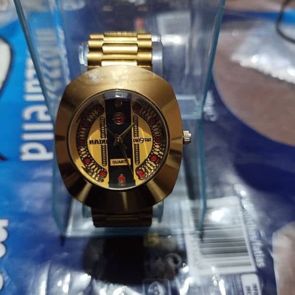 Rado golden  color watch 1