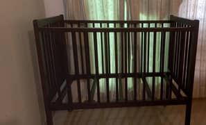 Wooden Baby cot.