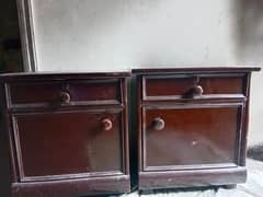 wooden bed with dressing table and sight tables