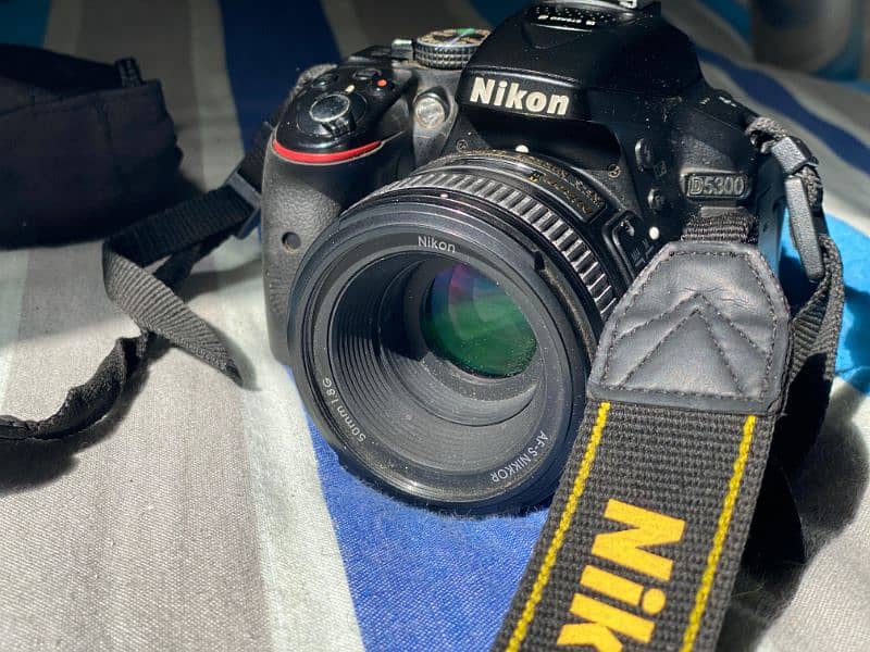 Nikon D5300 with kit lens and prime lens 50MM 1.8 with Camera Bag 9