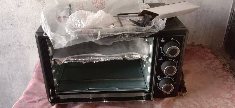 baking & giriling oven new urgent sell just three time use 25 litter 5