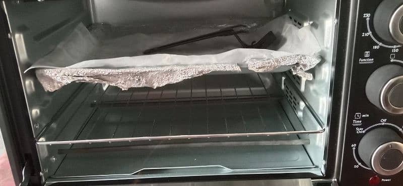 baking & giriling oven new urgent sell just three time use 25 litter 8