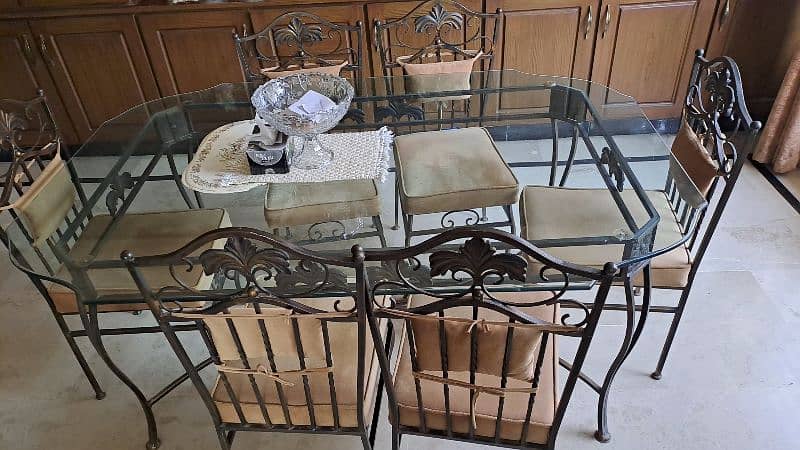 Almost new wrought iron dining table with 6 chairs 2