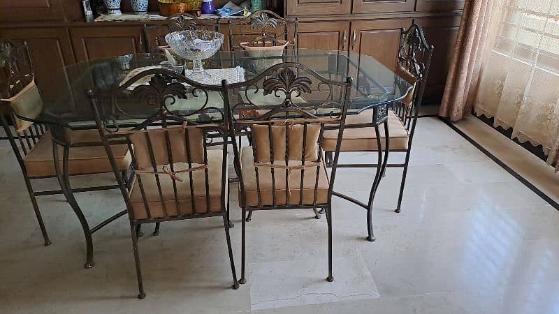 Almost new wrought iron dining table with 6 chairs 3