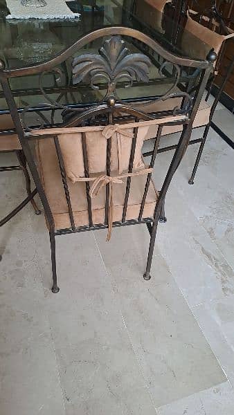 Almost new wrought iron dining table with 6 chairs 5