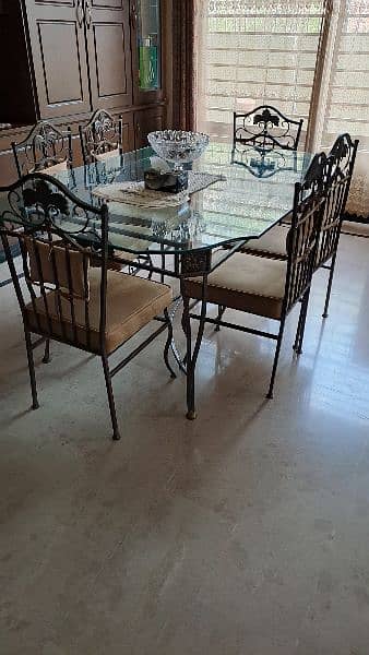 Almost new wrought iron dining table with 6 chairs 6