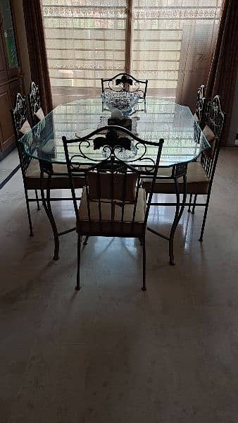 Almost new wrought iron dining table with 6 chairs 7