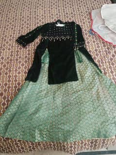 this  is a lhenga for 12 year girl in bottle green color