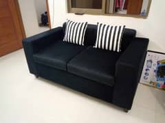 2 seater velvet sofa with  silver cushions