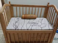 wooden coat with cribs and mattress