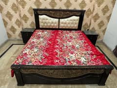 king size bed with 2 side tables and looking mirror