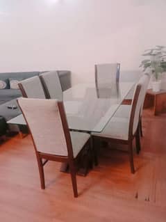 Glass top dining table for 6 persons