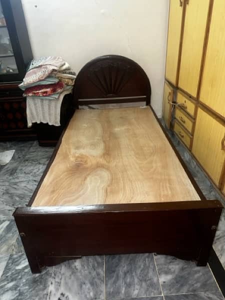 2 WOODEN SINGLE BED CNDITION IS GOOD 2