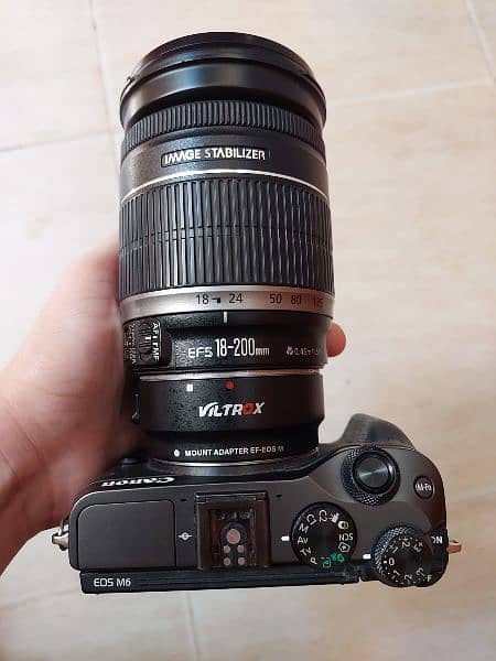 Canon mirrorless m6 with lens, stand, rgb light, mic and lens mount 9