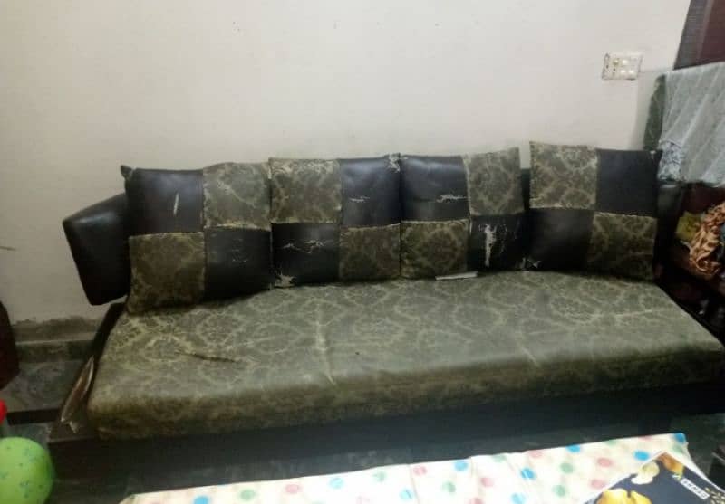 Sofa set used and fabric in torn condition 1