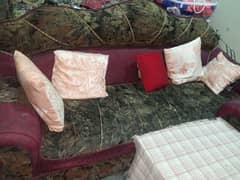 red sofa set with cushions