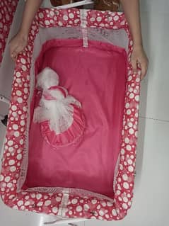 Baby cradle swing with mosquito net.