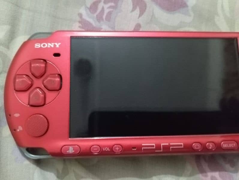 PSP Slim 3003 model with 8GB Memory card & original adapter 8