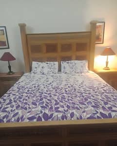 king size double bed with side tables and dressing table