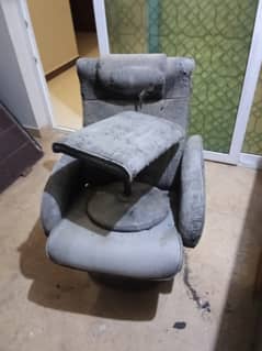 nice recliner with footrest leather torn out